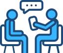download - Sparsh Hospital - Sparsh Hospital Two blue figures sit across from each other at a table, engaging in conversation with a speech bubble above one person.